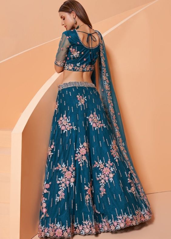 image of bridal lehenga with beige and blue hand-woven patterns